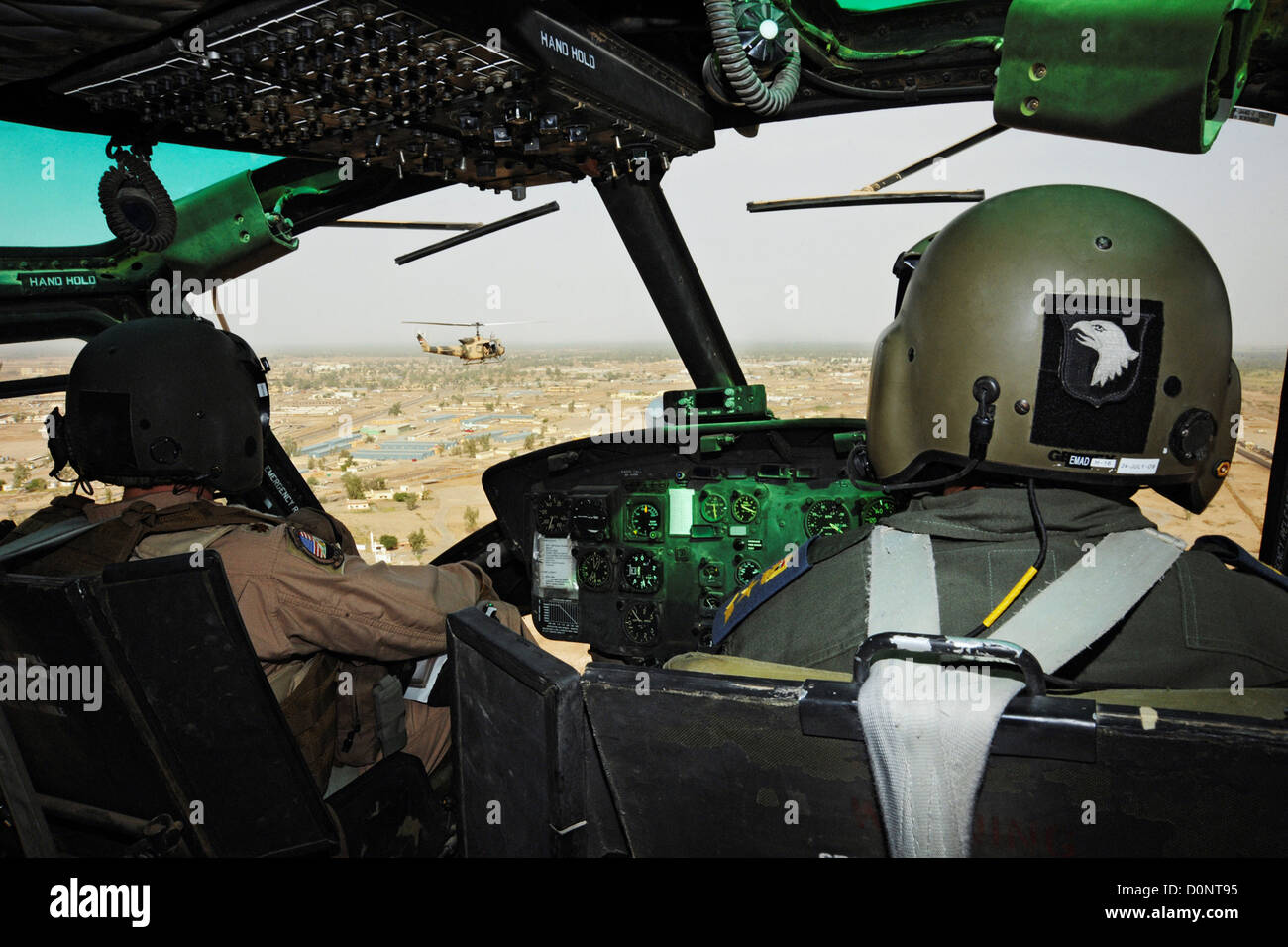 Maj. Jack Swinehart (left) demonstrates aerial formation flying procedures Iraqi pilot over Camp Taji Iraq. Iraqi students Stock Photo