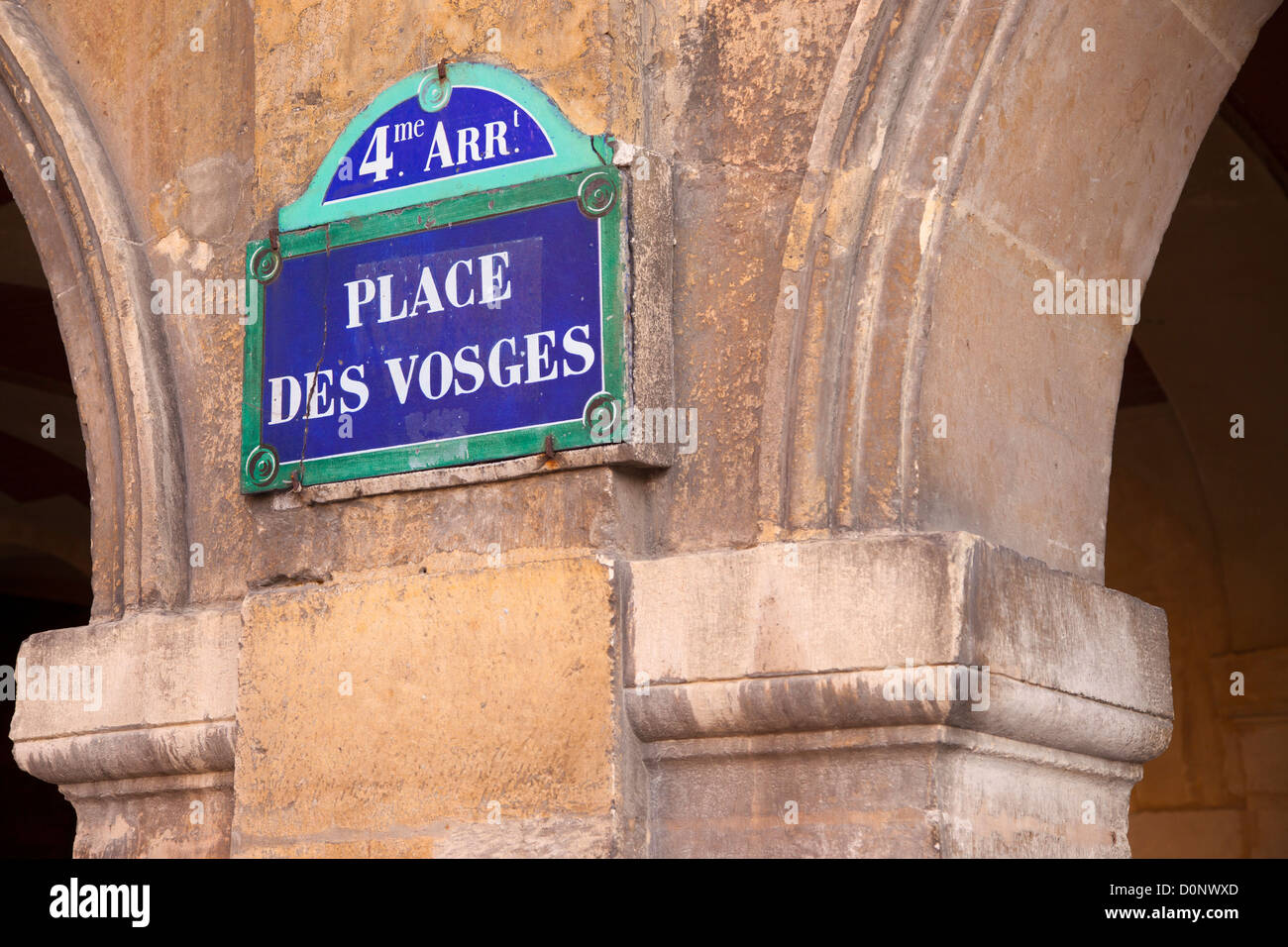 Place des Vosges sign along the walkway surrounding the famous public square in les Marais, Paris France Stock Photo