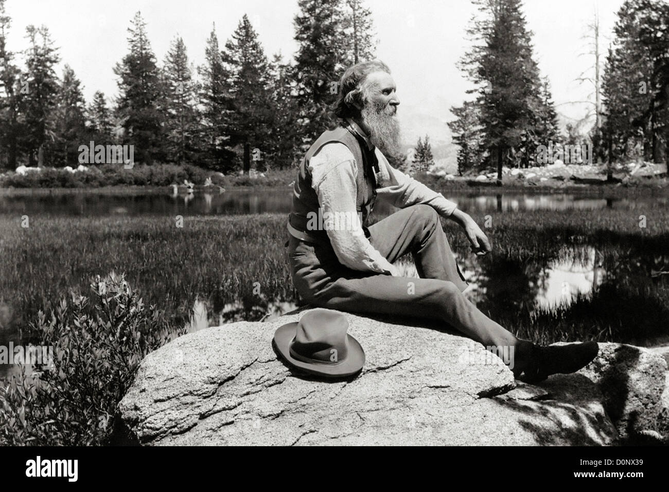 Naturalist John Muir Sitting by Lake Stock Photo