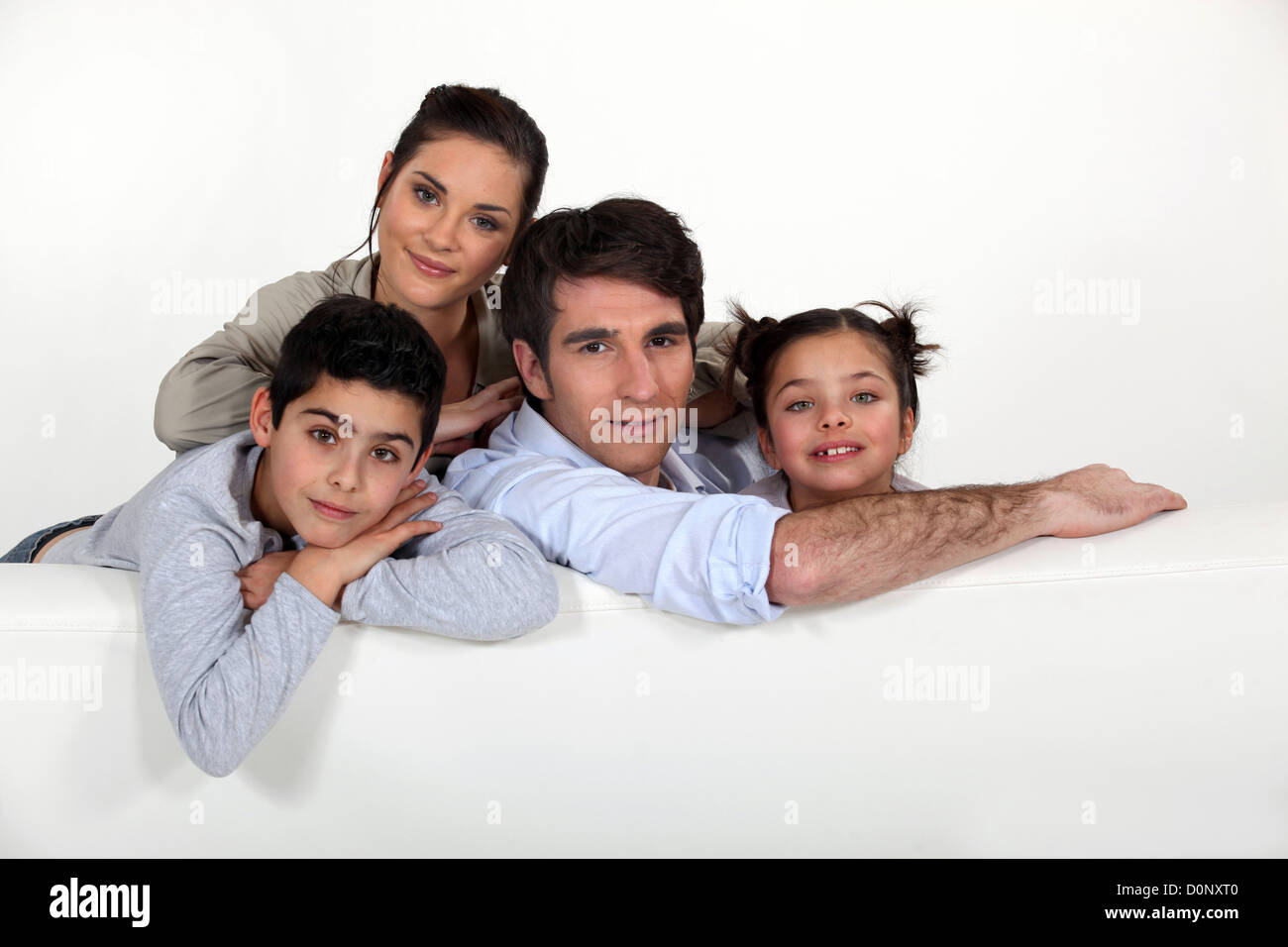 Family sat on couch Stock Photo