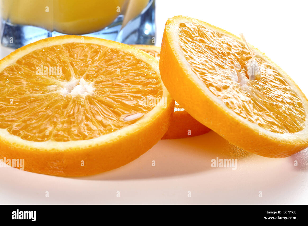 Segments of an orange and a glass of juice Stock Photo