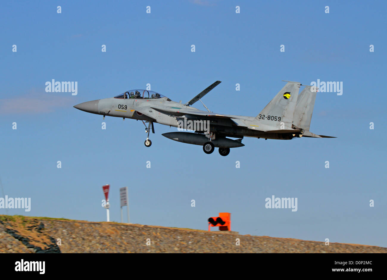 The Mitsubishi F-15DJ Eagle fighter of the Japan Air Self-Defense Force to land Stock Photo