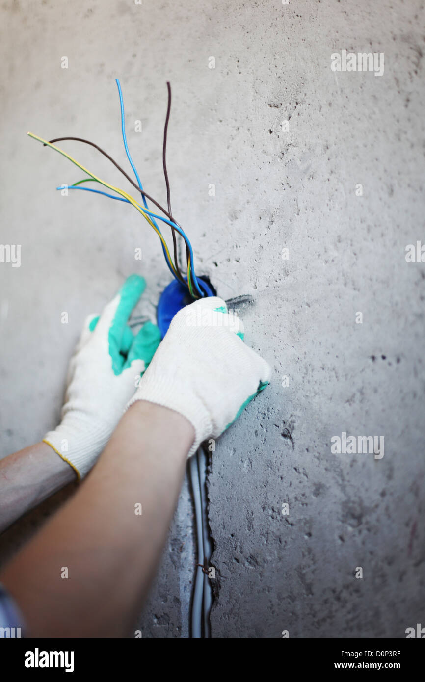 Worker installing new electronic hi-res stock photography and images ...