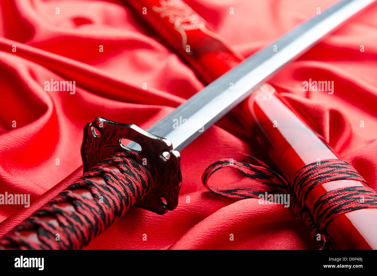 Takana Ras Japanese sword takana on red satin background Stock Photo - Alamy