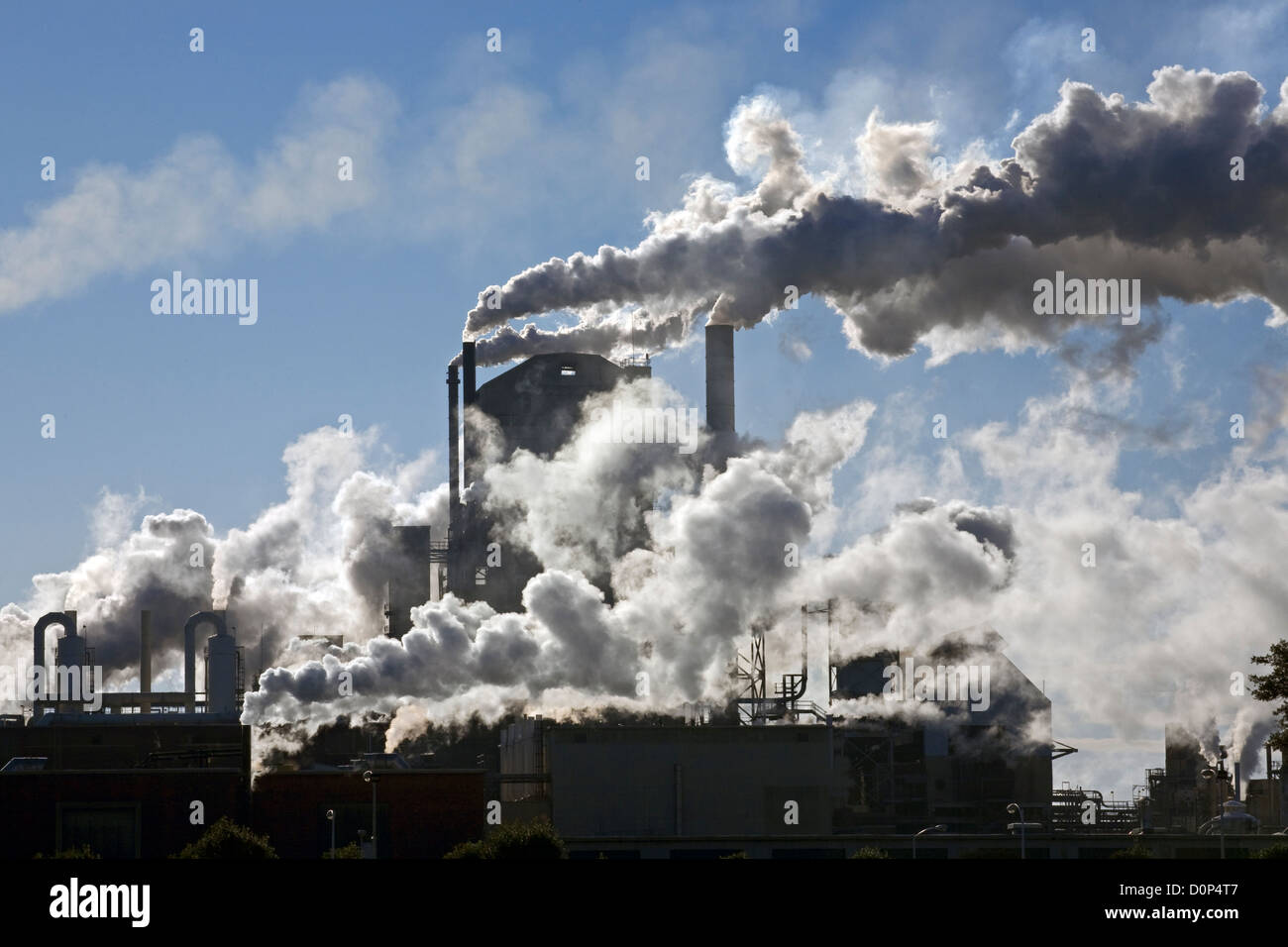 GA00132-00...GEORGIA - Smoke and steam issuing from multiple smokestacks at a fibers factory in the town of Jesup. Stock Photo