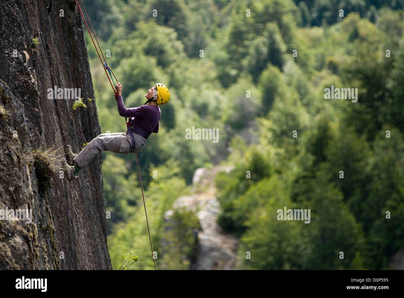 Woman Ralphing Woman rappelling down a cliff above Chile's Futaleufu River Stock Photo ...