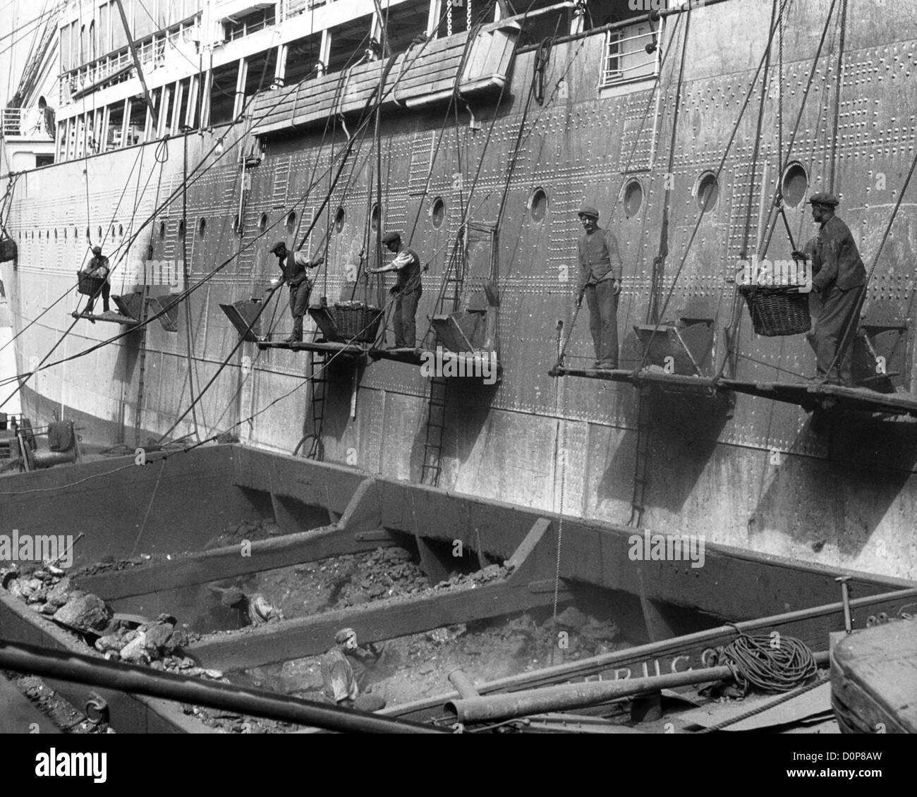 Coaling a passenger liner in Southampton Stock Photo