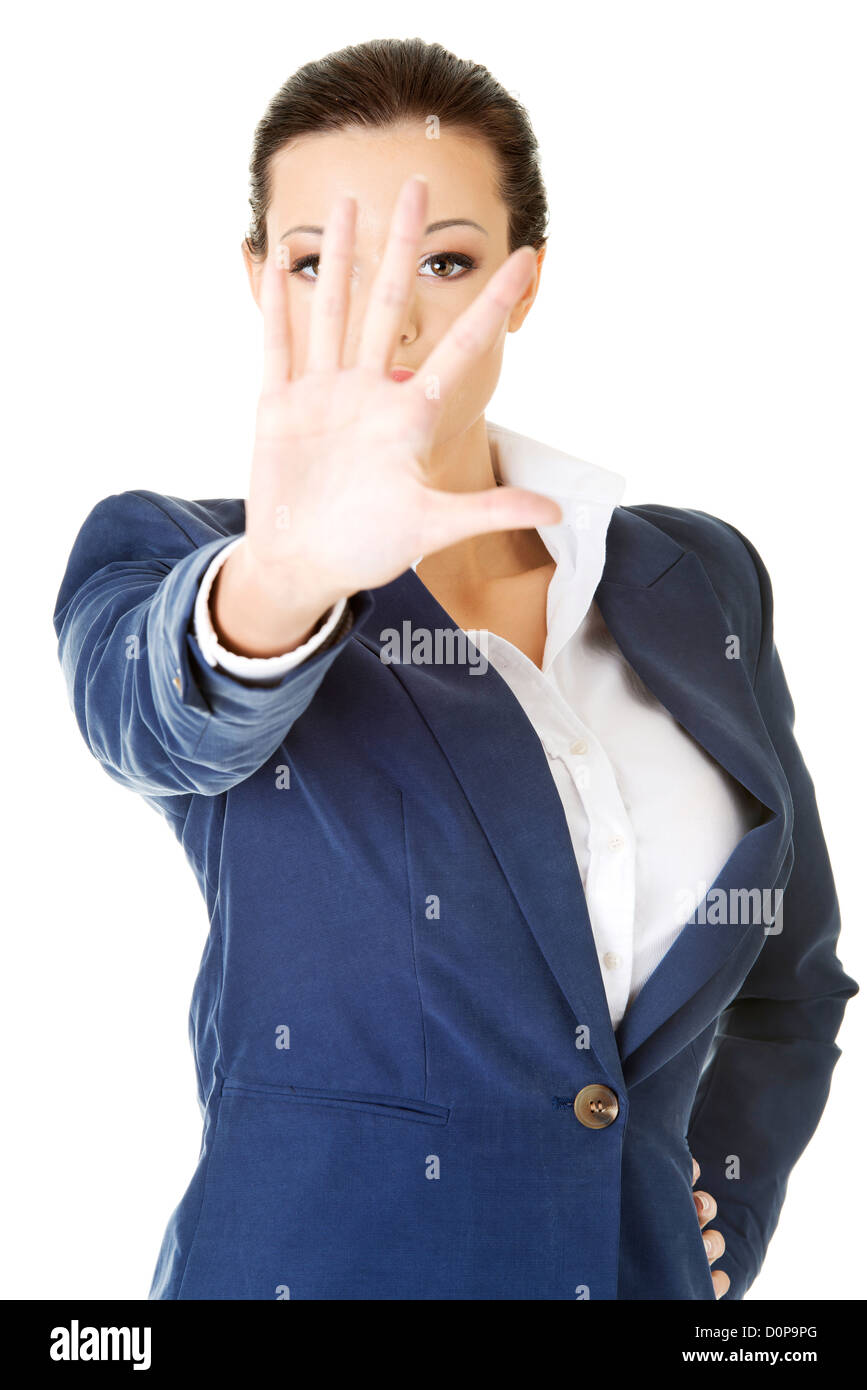 Serious business woman making stop sign over white Stock Photo - Alamy