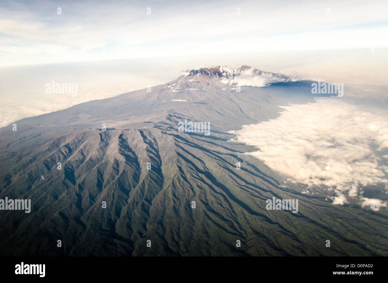 MT KILIMANJARO, Tanzania - Mount Kilimanjaro Aerial View Wide Shot. An aerial view of Mount Kilimanjaro, the highest peak in Africa, with a snow-covered peak. Stock Photo