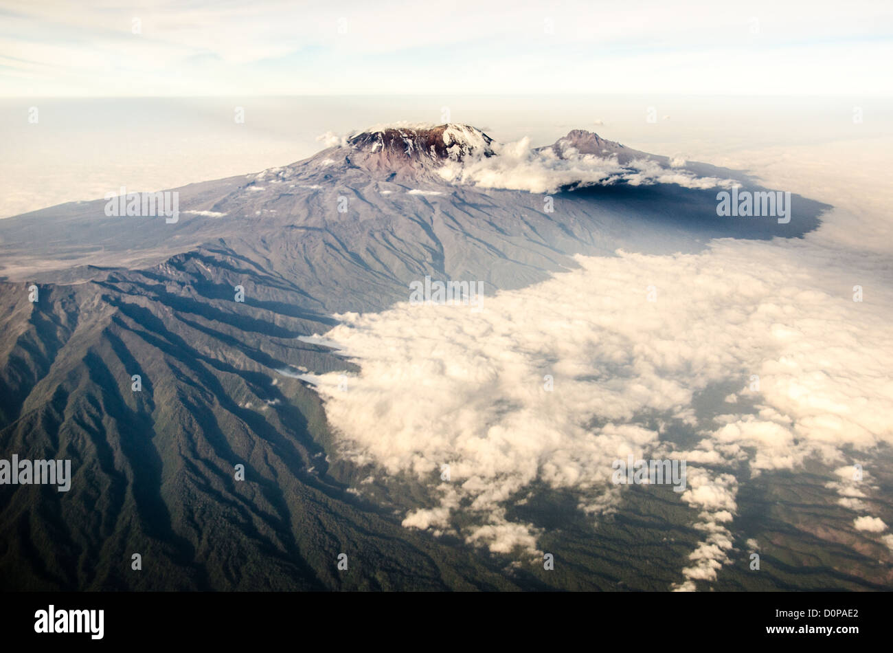 MT KILIMANJARO, Tanzania - Mount Kilimanjaro Aerial View Summit with Snow. An aerial view of Mount Kilimanjaro, the highest peak in Africa, with a snow-covered peak. Stock Photo