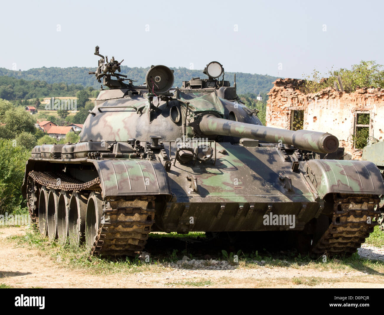 old army tank infront of ruins Stock Photo
