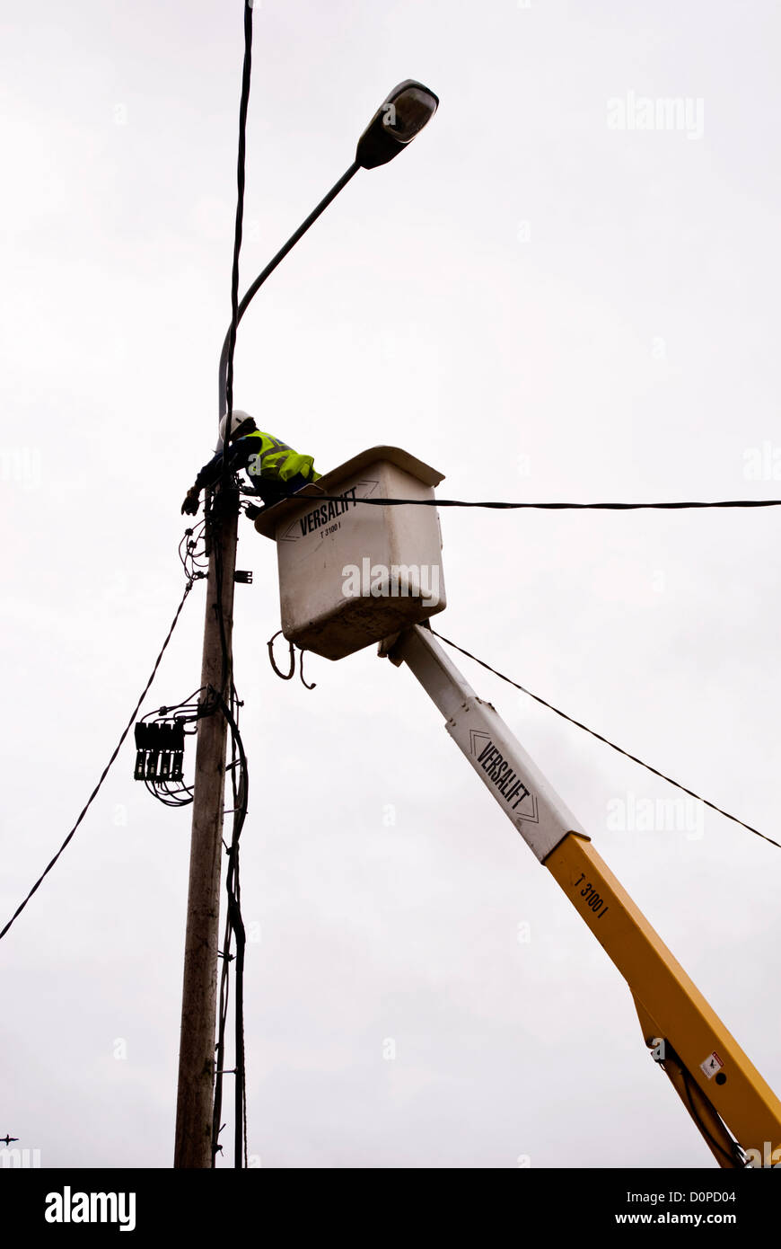 ESB engineer repairing street lighting wiring on a Versalift crane
