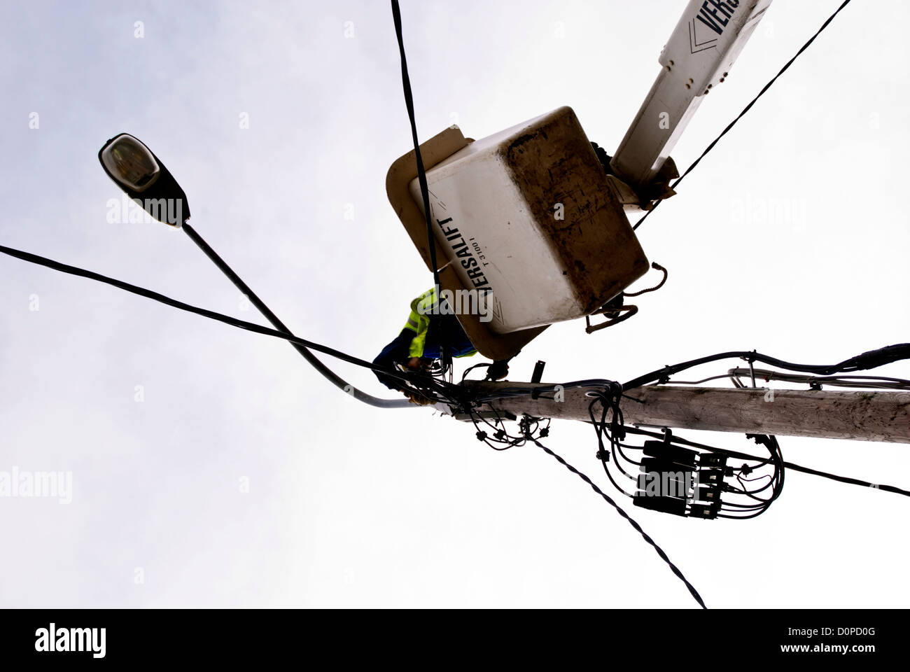 ESB engineer repairing street lighting wiring on a Versalift crane