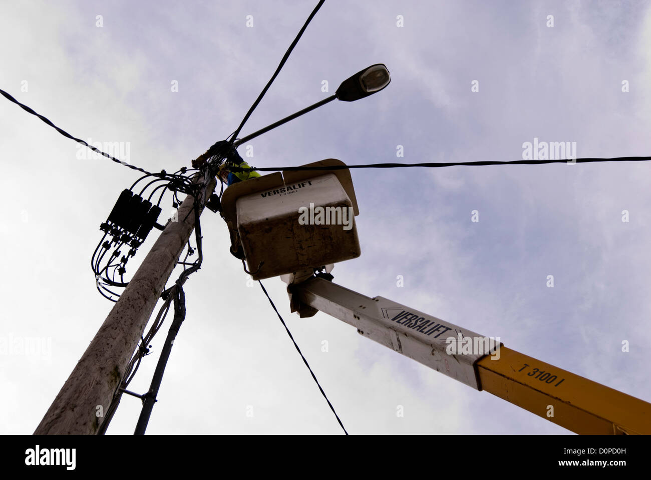 ESB engineer repairing street lighting wiring on a Versalift crane