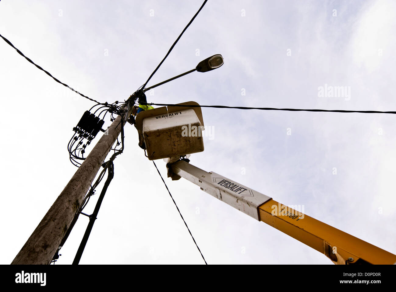 ESB engineer repairing street lighting wiring on a Versalift crane