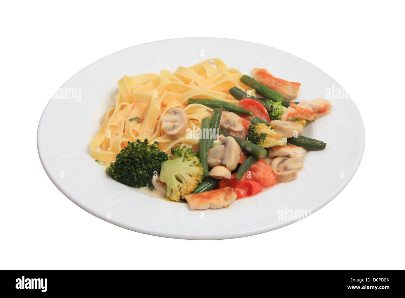 Healthy pasta dish with broccoli, mushrooms, chicken and string beans Stock Photo