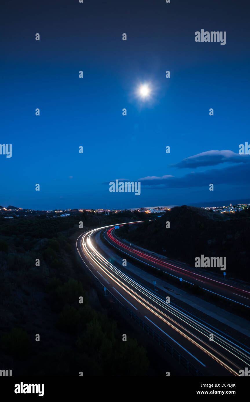 Lights from fast moving vehicles on the motorway leading to Malaga, Spain Stock Photo
