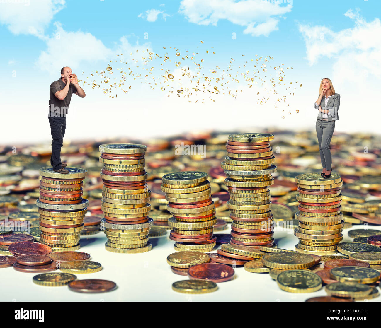 man and woman and money talk on coin piles Stock Photo