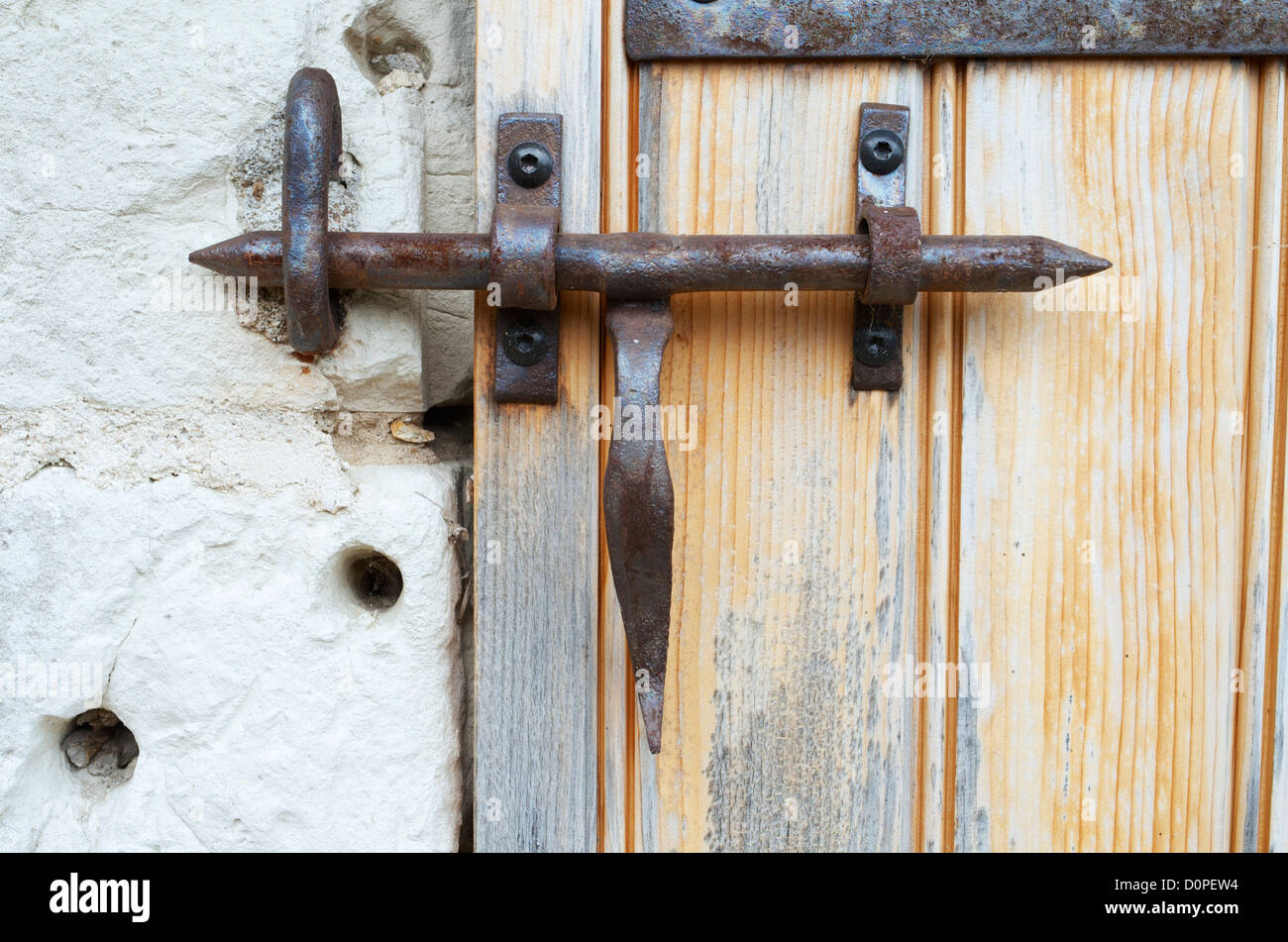 wrought iron lock on an old wooden door Stock Photo - Alamy