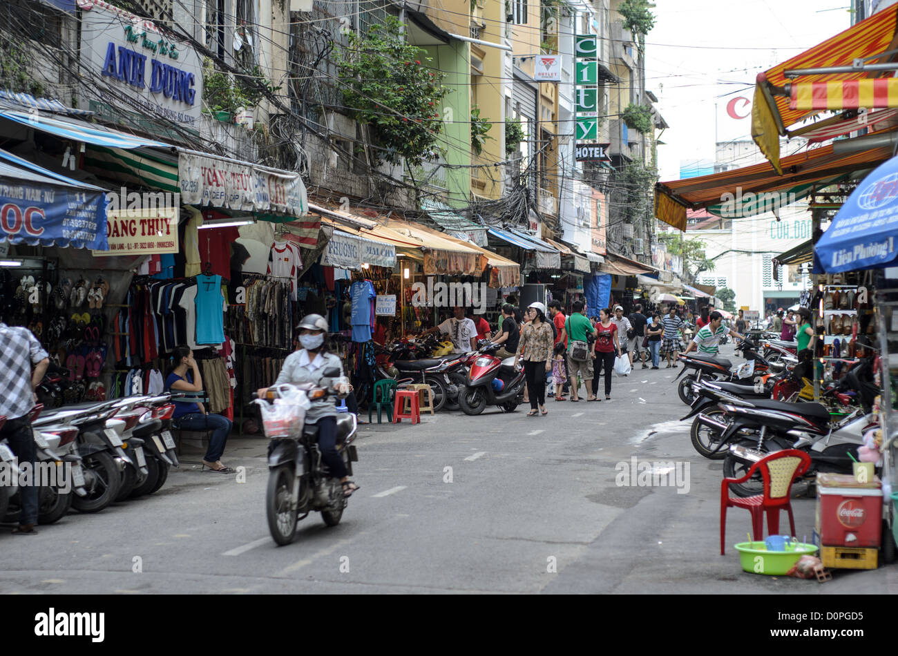 HO CHI MINH CITY, Vietnam — Ben Thanh Market stands as one of Ho Chi Minh City's most prominent commercial centers and tourist destinations. The market, originally built during French colonial rule in the early 20th century, serves as a major hub for local commerce and international visitors. Located in District 1, the market features hundreds of stalls selling goods ranging from traditional Vietnamese handicrafts to clothing and local food specialties. The distinctive clock tower above the main entrance has become an iconic symbol of the market. Ben Thanh Market operates as both a traditional Stock Photo