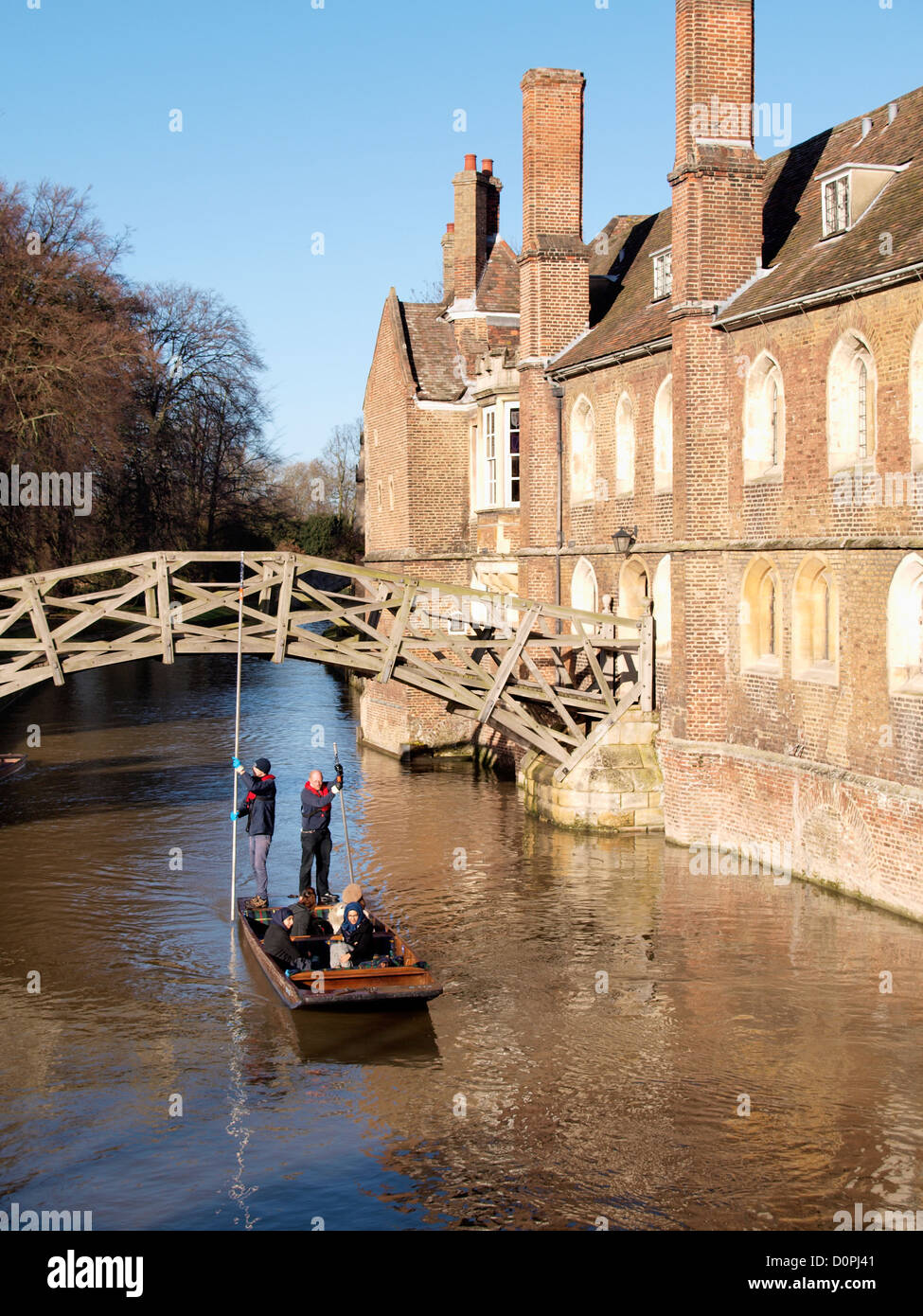 Punting under The Mathematical Bridge, The River Cam, Cambridge, UK Stock Photo