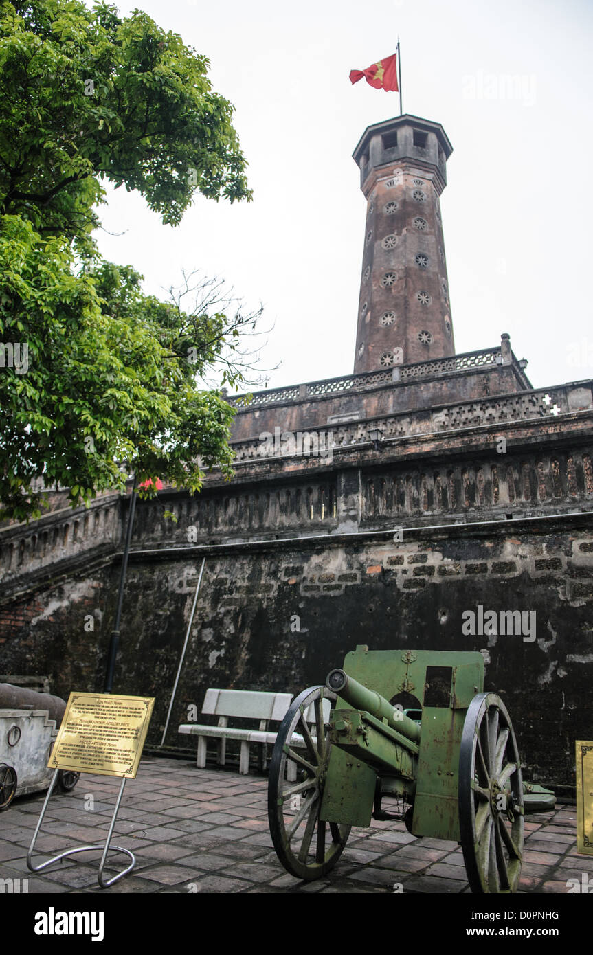 HANOI, Vietnam - HANOI, Vietnam - The Hanoi Flag Tribune is a centerpiece of the Vietnam Military History Museum. The tower was built in the early 19th century (1805-1812) and stands 33.5 meters tall. A 54-step spiral staircase leads to the top, where there is a small viewing room. A national flag has flown atop the tower night and day since October 10, 1954, after the defeat of the French at Dien Bien Phu. The monument has been designated by the Ministry of Culture and Information as a National Cultural and Historic Relic. The museum was opened on July 17, 1956, two years after the victory ov Stock Photo