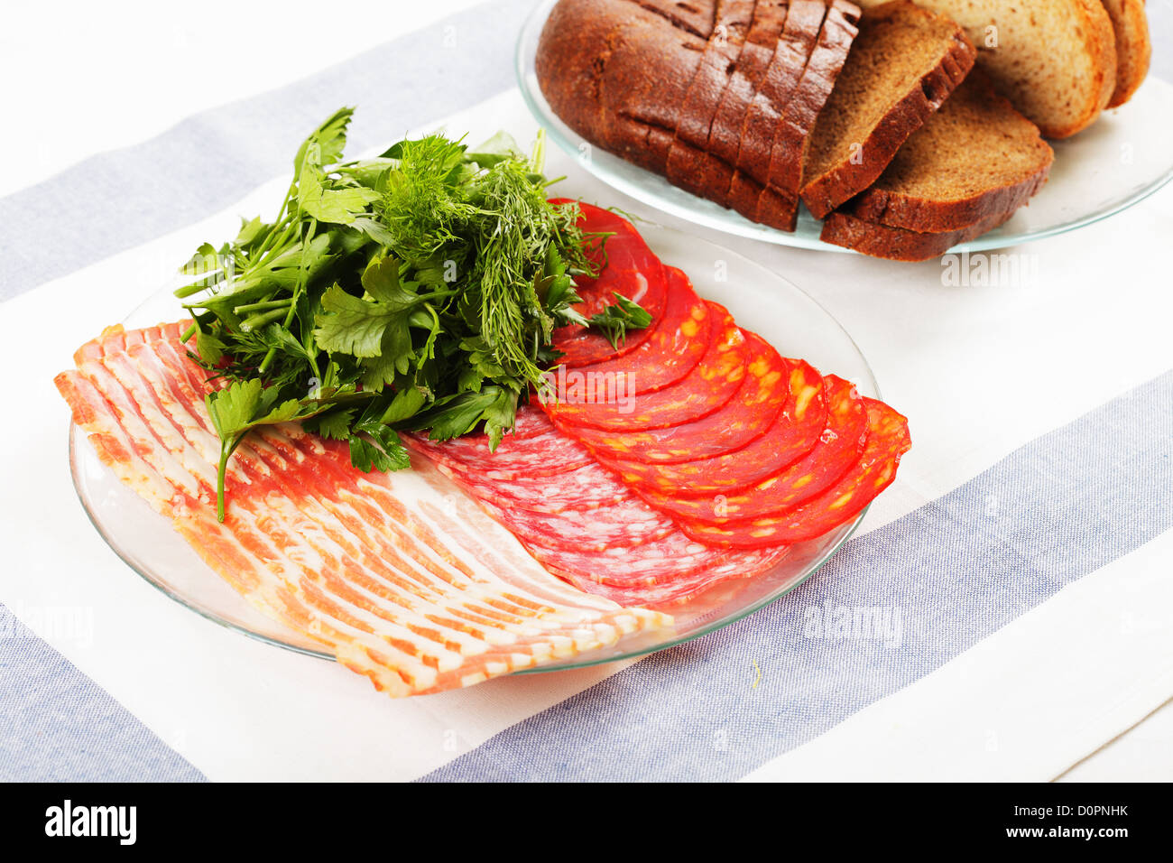 Sliced meat and greens on plate Stock Photo Alamy