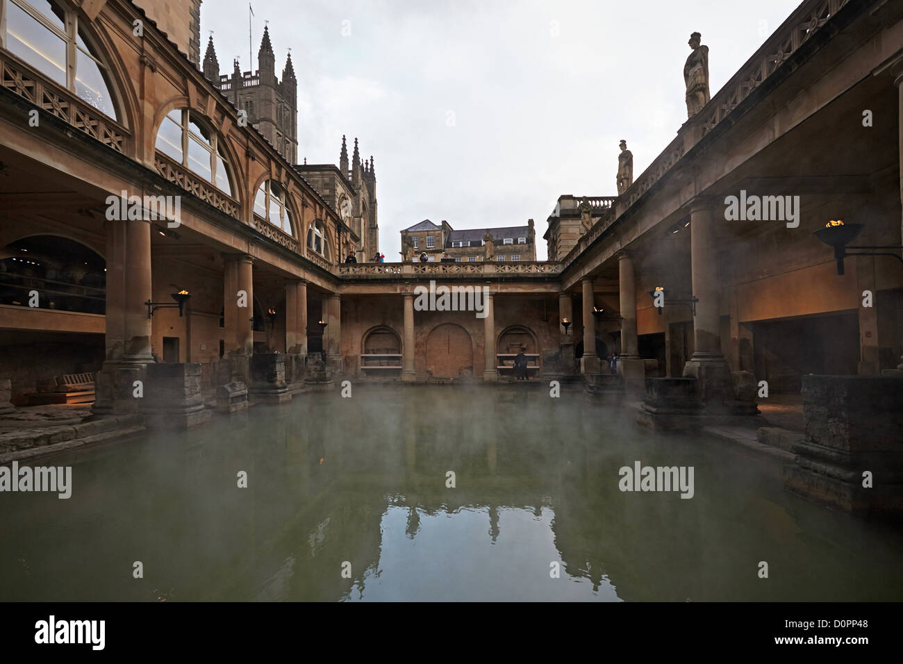 Bath Roman baths and a view of The Great Bath with Bath Abbey behind Stock Photo