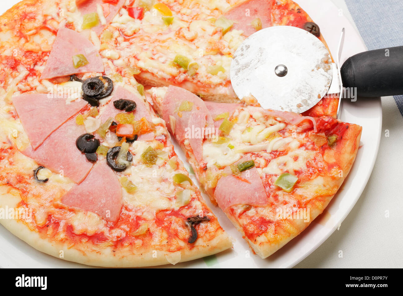 Cutting pizza Stock Photo Alamy