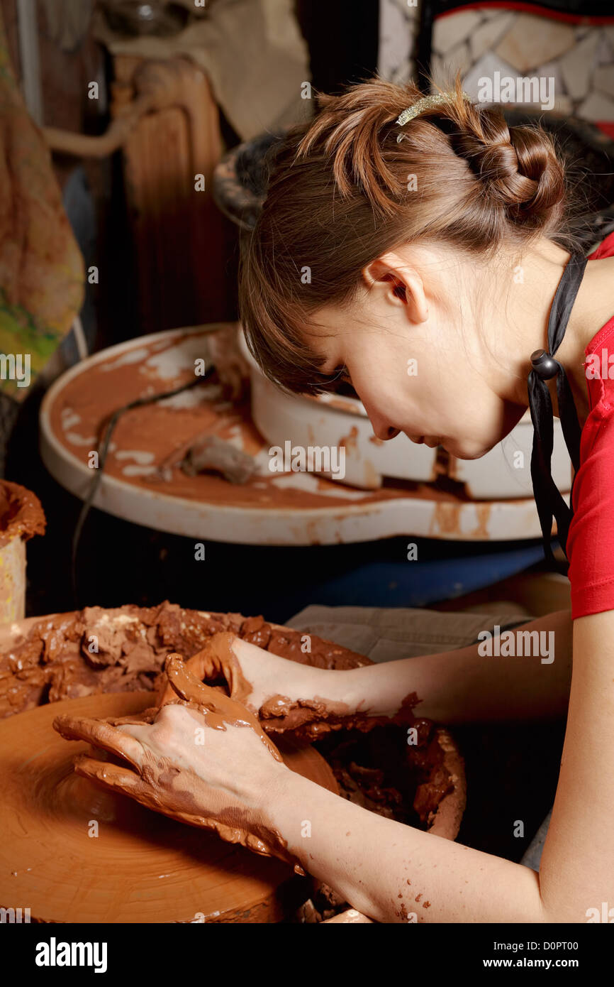 Woman working in pottery Stock Photo - Alamy