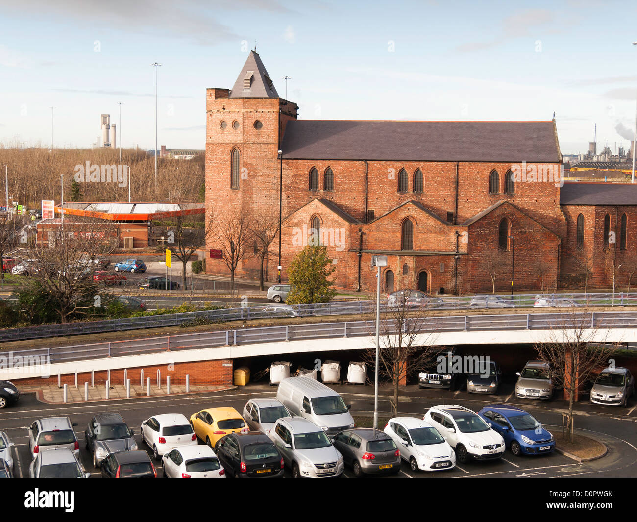St. Columba’s Anglican church in Middlesbrough built 1902 in a residential area now isolated among car parks and busy roads Stock Photo