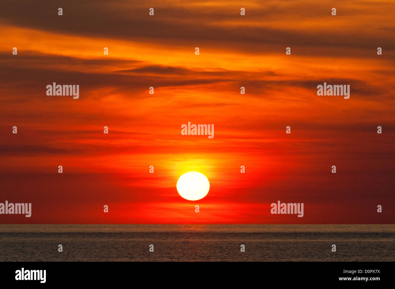 Fiery sunset over the Indian Ocean. Stock Photo