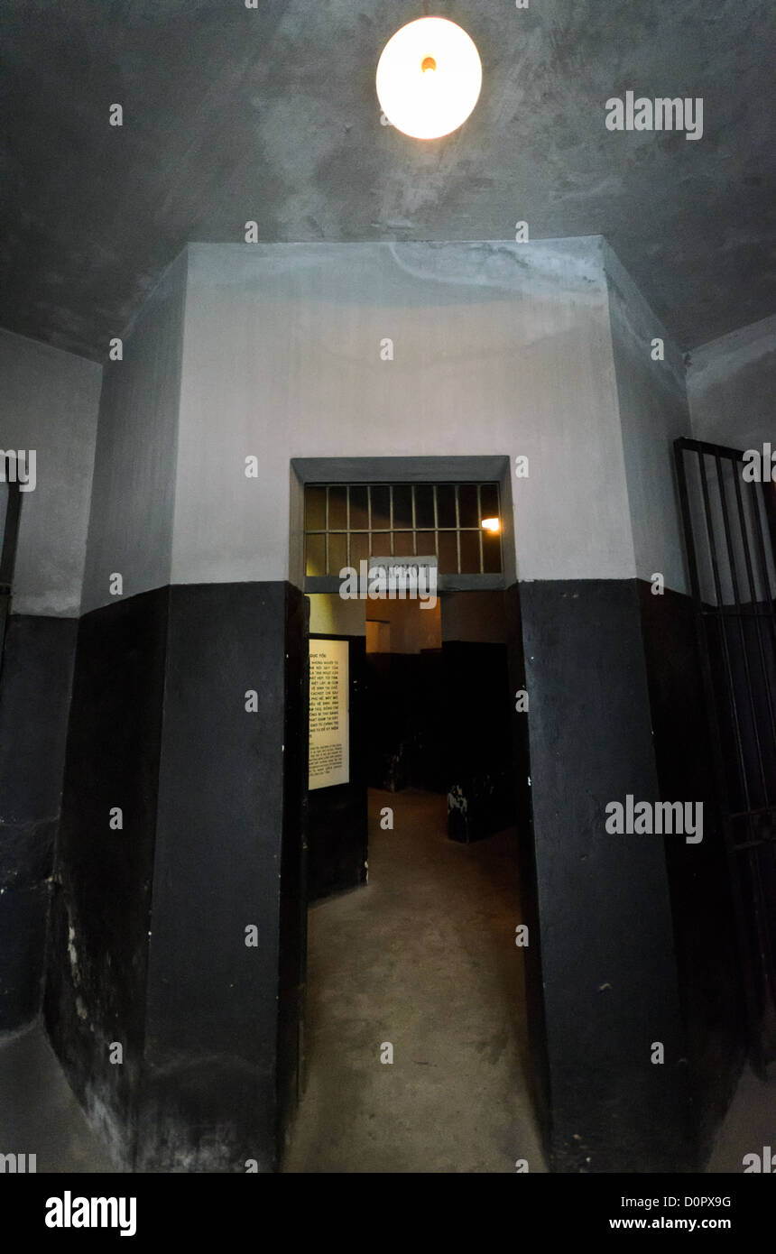 HANOI, Vietnam - The entrance to the area known as the dungeon of Hoa Lo Prison. Used for solitary confinement and 'special' treatment, these rooms were dark and small. Inmates were shackled in place in their cells.  Hoa Lo Prison, also known sarcastically as the Hanoi Hilton during the Vietnam War, was originally a French colonial prison for political prisoners and then a North Vietnamese prison for prisoners of war. It is especially famous for being the jail used for American pilots shot down during the Vietnam War. Stock Photo