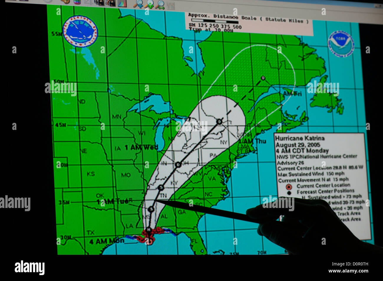 NASA Hurricane Katrina weather map silhouette hand pointing path Stock Photo
