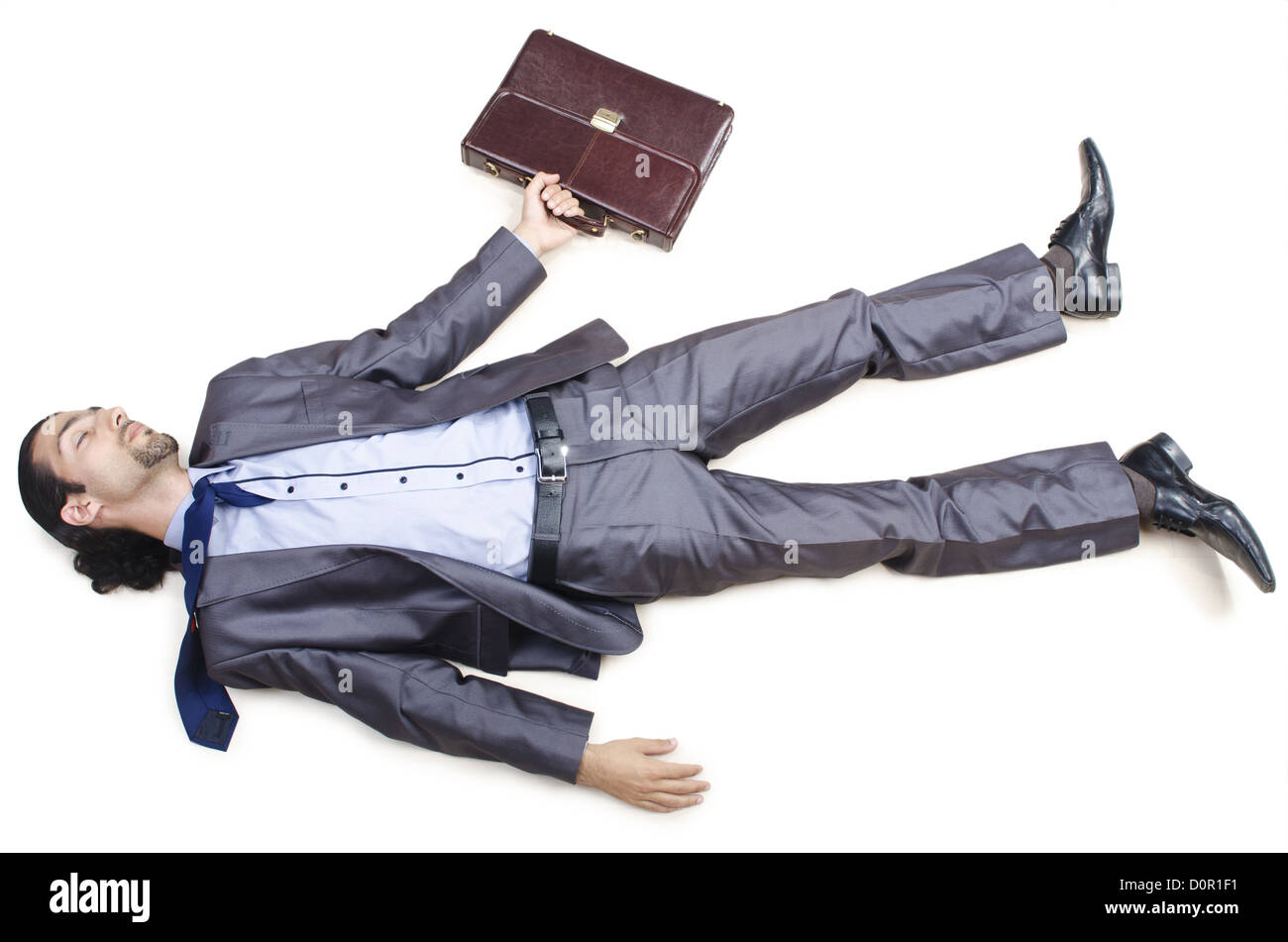 Dead businessman on the floor Stock Photo