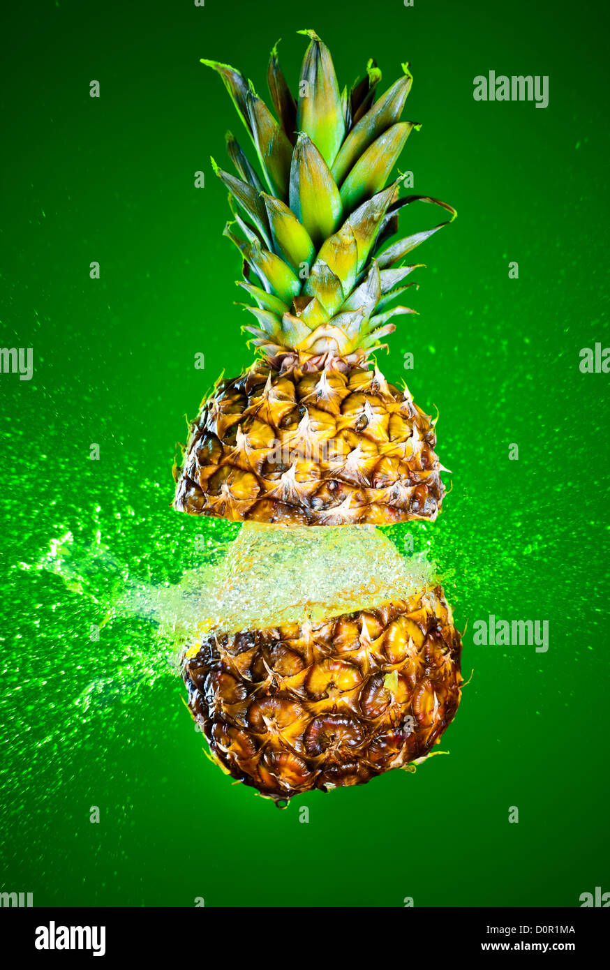 Pineapple splashed with water Stock Photo Alamy