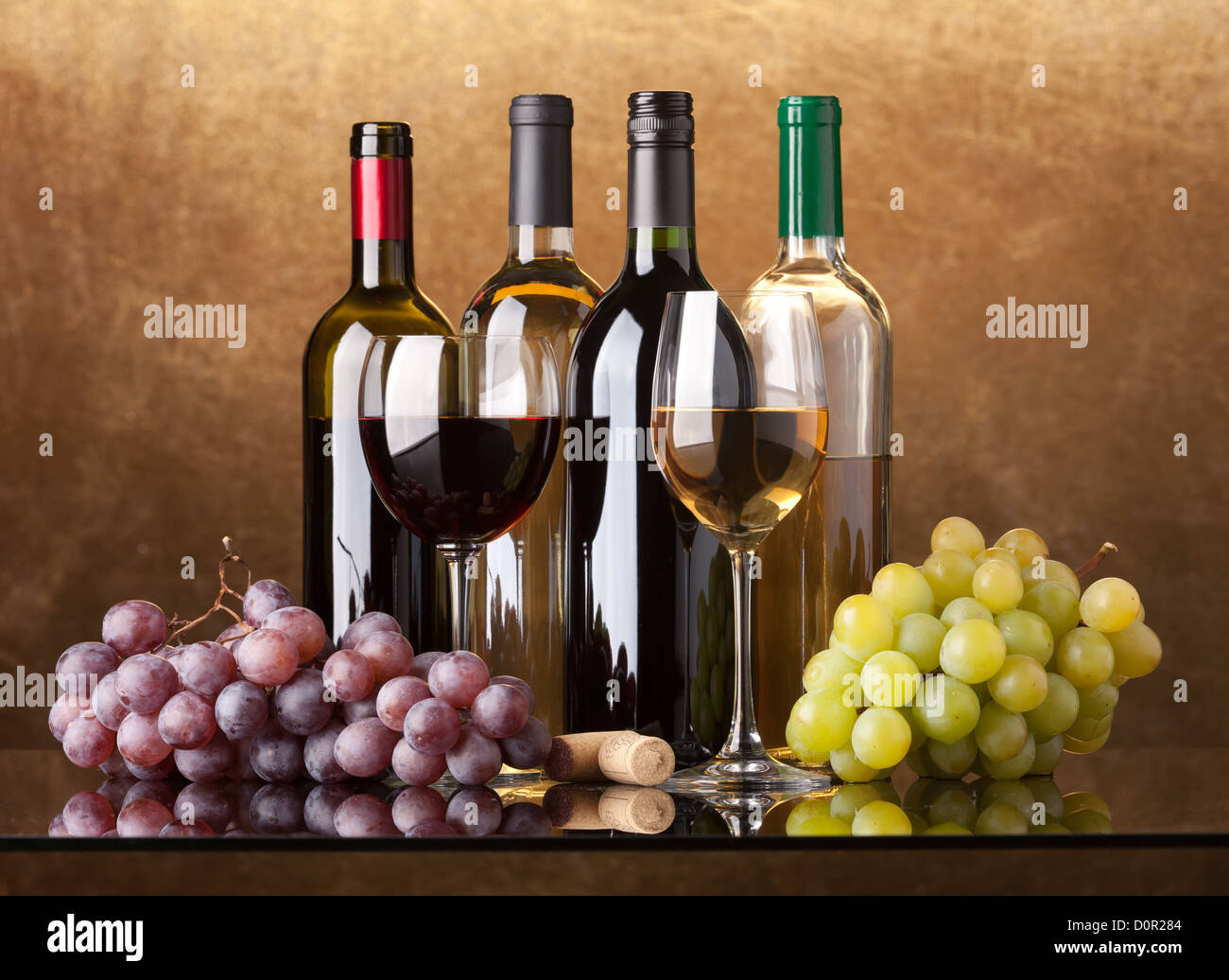 Bottles, glasses and grapes Stock Photo