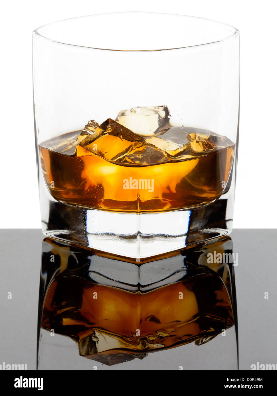Glass of whiskey with ice cubes Stock Photo Alamy