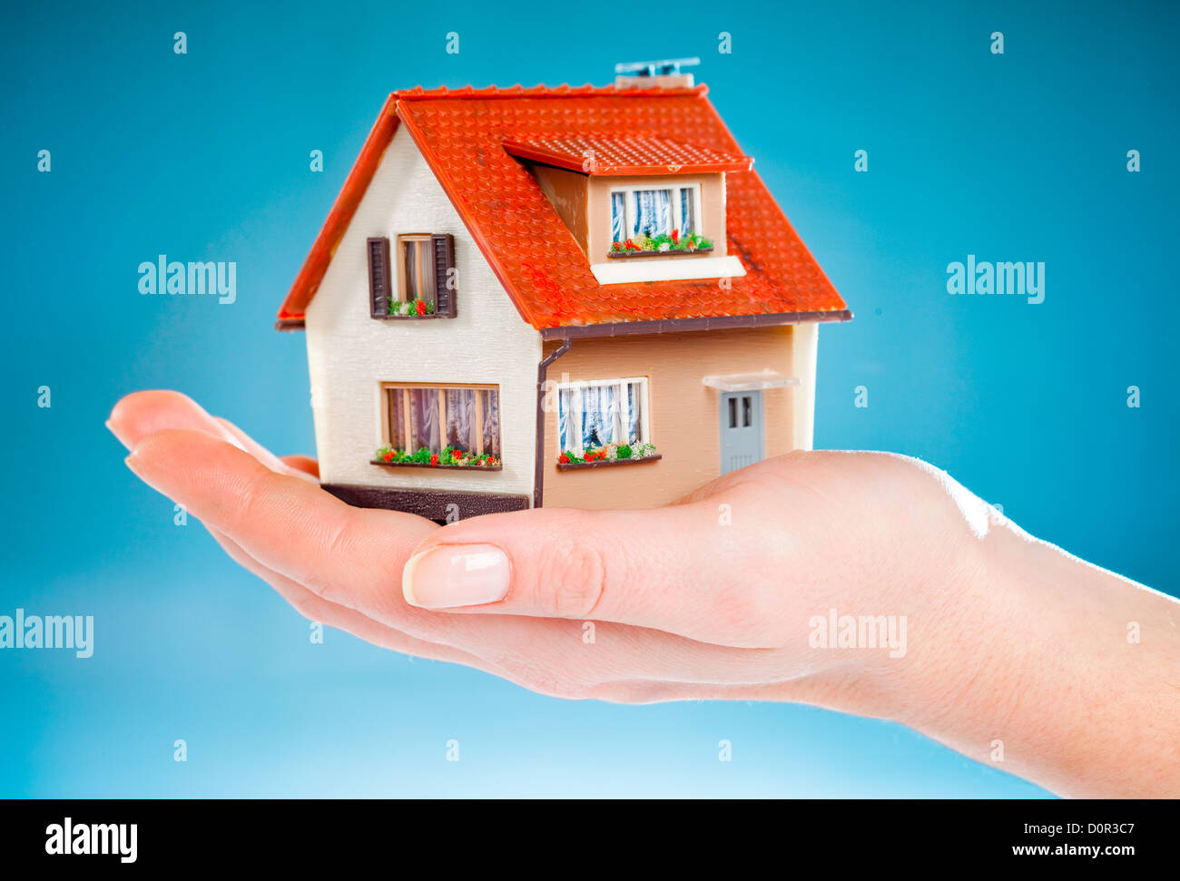 house in human hands Stock Photo - Alamy