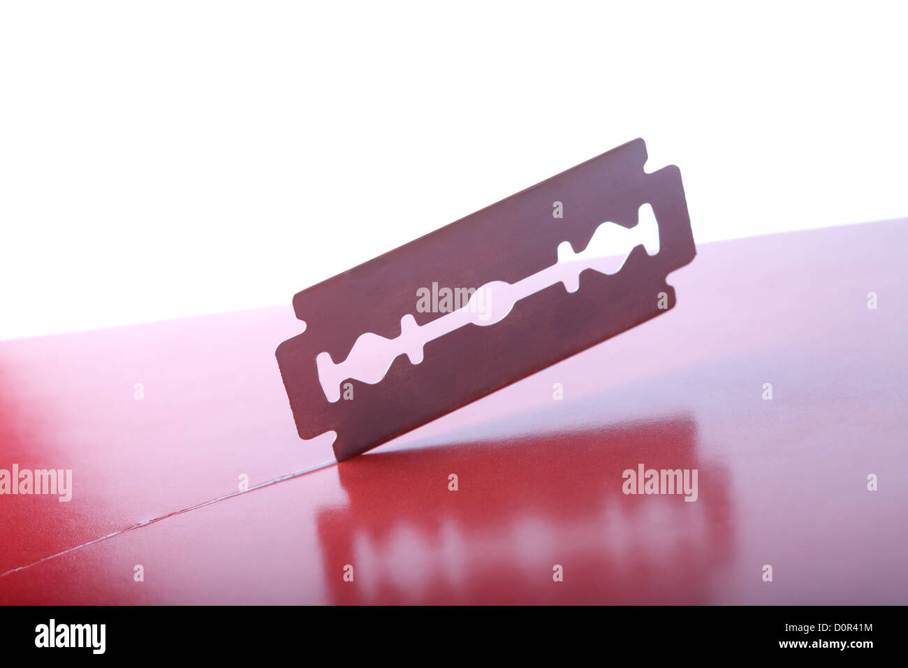 The safety razor cuts paper Stock Photo Alamy