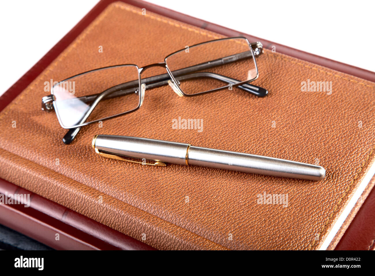 Organizer glasses and fountain pen Stock Photo - Alamy