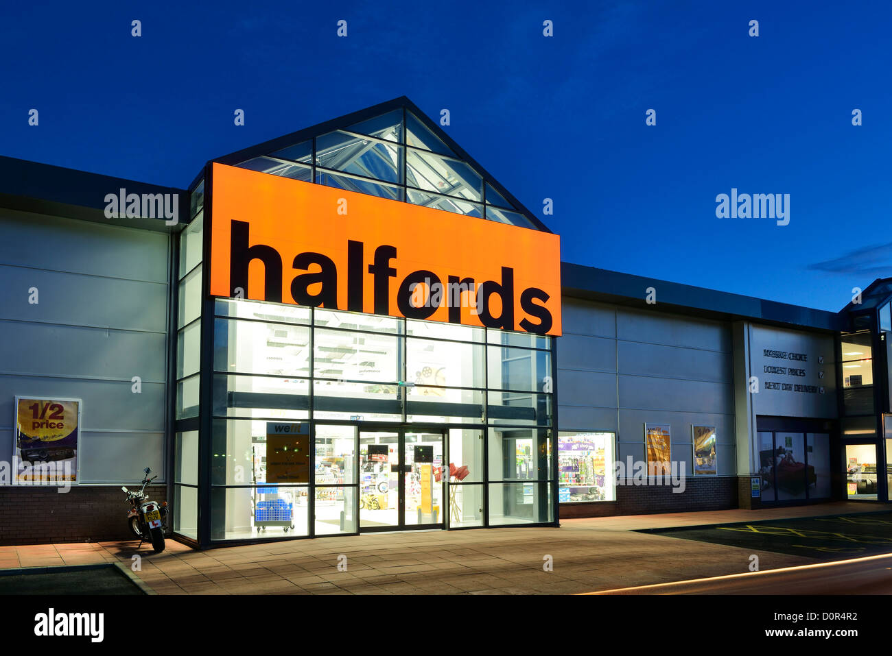Halfords retail unit shop entrance Stock Photo