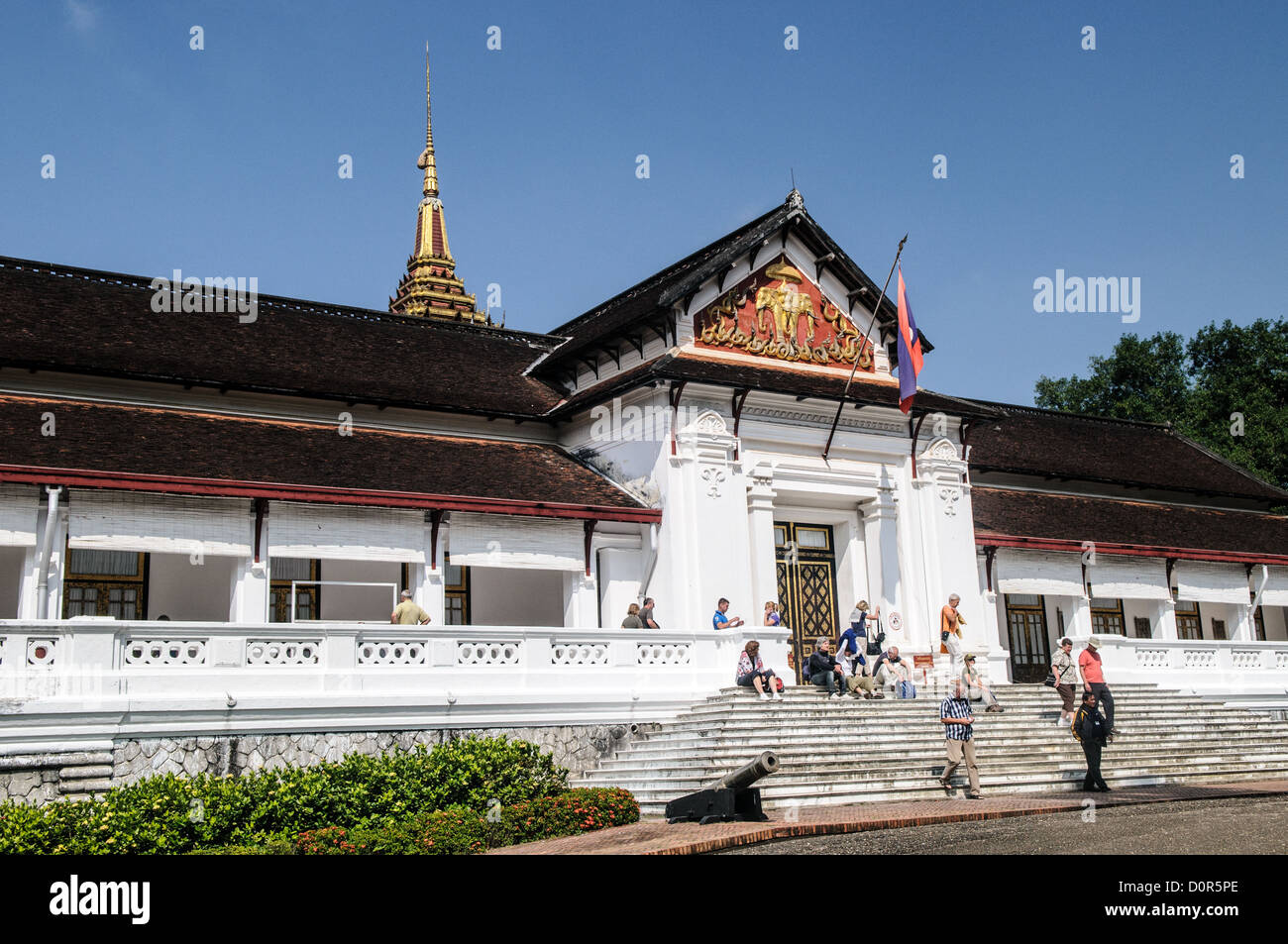 LUANG PRABANG, Laos - Tourists milling on the stairs of the main palace building in the Royal Palace Museum of Luang Prabang, Laos. Stock Photo