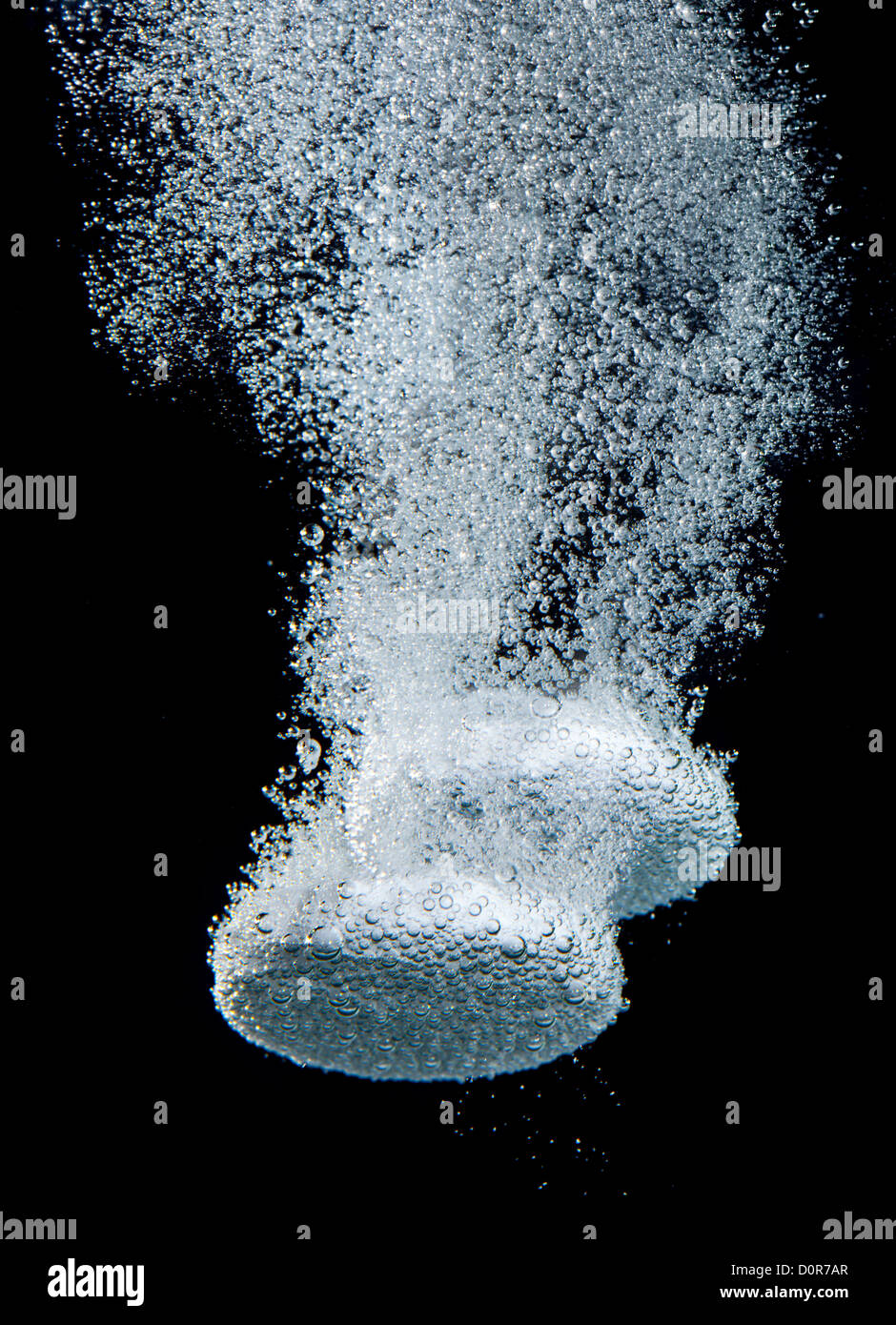 Effervescent tablet in water with bubbles Stock Photo Alamy