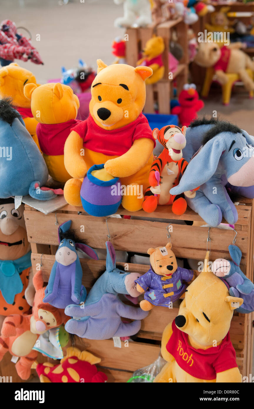 Winnie the Pooh toys for sale at a local market Stock Photo - Alamy