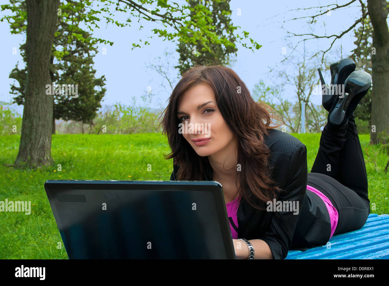 Young woman is working on laptop Stock Photo - Alamy