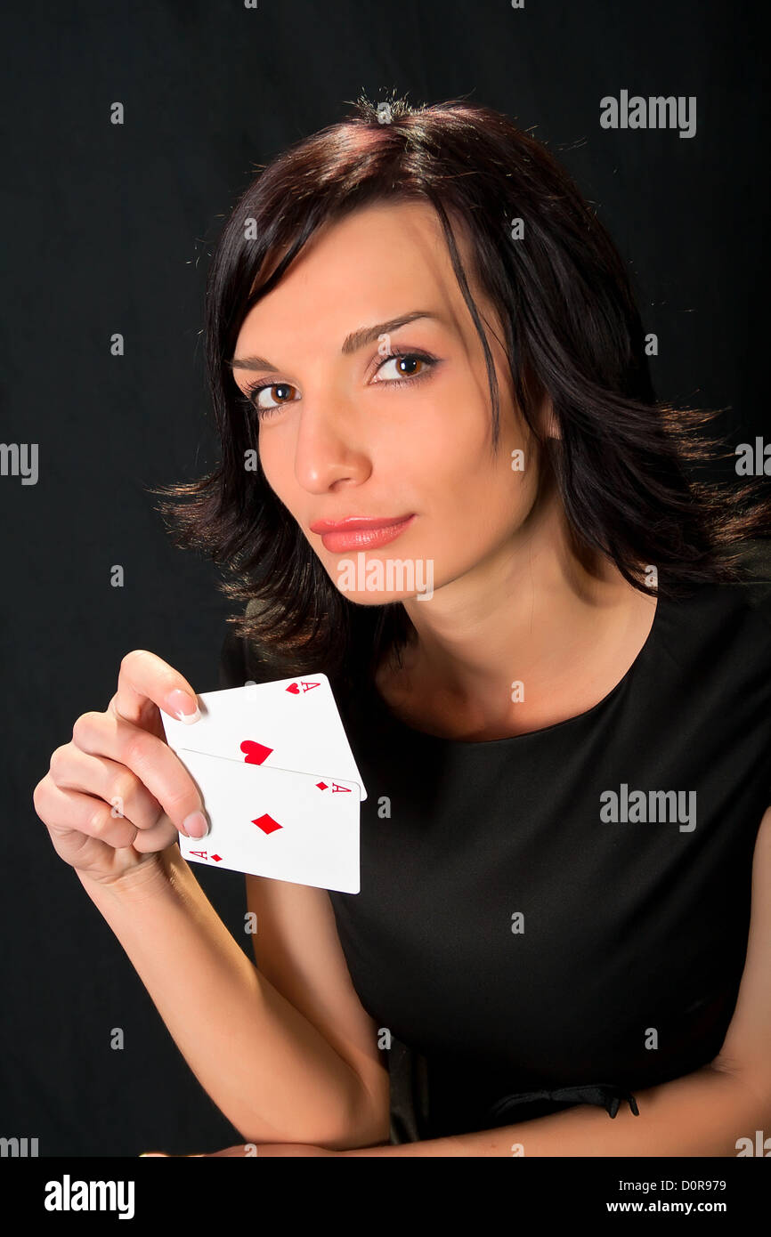 Young lucky gambler with cards Stock Photo - Alamy