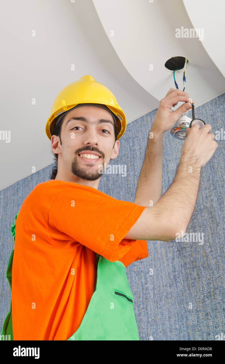 Electrician repairman working on refurbishment Stock Photo Alamy