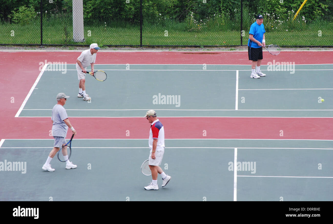 Active seniors playing tennis Stock Photo - Alamy