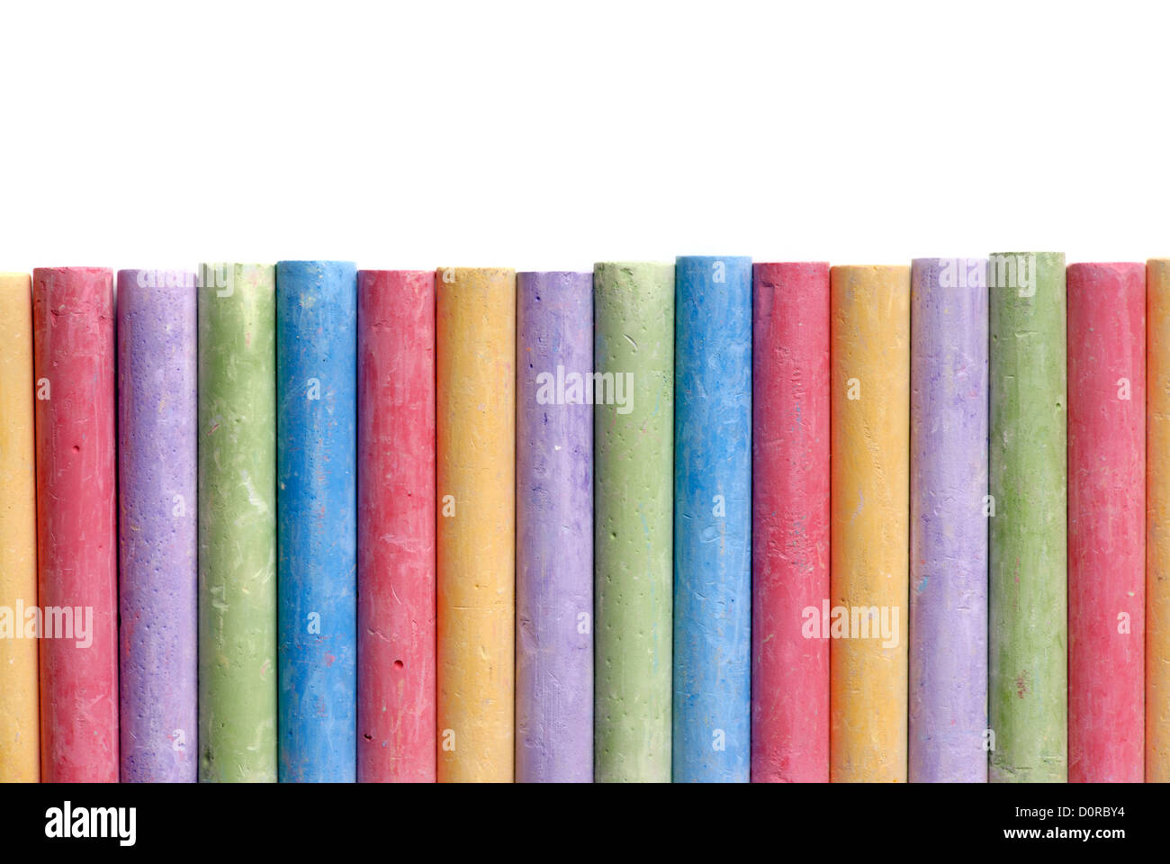 Close Up Of Coloring Crayons Arranged In Rainbow Line Stock Photo